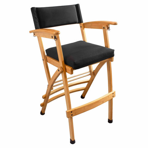 The 32" Deluxe Bamboo Director's Chair by Totally Bamboo features a light bamboo frame with a sleek black fabric seat and backrest. This elevated director's chair is designed with crossbar support at the base and equipped with black non-slip caps on the legs for enhanced stability.