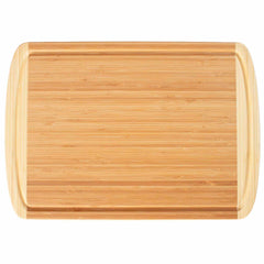 The Totally Bamboo Kona Groove Carving Board, measuring 18" x 12-1/2", is a rectangular bamboo cutting board with smooth, rounded edges and a lighter color border, ideal for kitchen prep work. Its surface features a natural wood grain pattern.