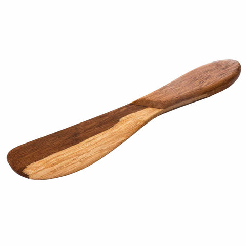 The Totally Bamboo 2-Tone Bamboo Spreading Knife, 8", features a smooth, tapered design that elegantly combines light and dark bamboo tones. Its spreading end is wider and gently narrows to an ergonomic handle, making it ideal for charcuterie boards.