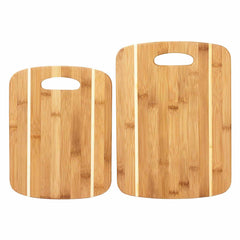 Two bamboo cutting boards from the 2-Piece Striped Bamboo Cutting Board Set by Totally Bamboo, designed in a rectangular shape with rounded edges and featuring alternating light and dark grain patterns. These essential kitchen accessories each come with a cut-out handle at the top for easy handling. The boards differ slightly in size and are positioned next to each other.