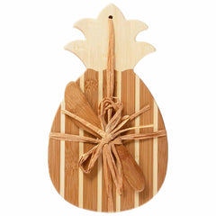 The Pineapple Serving Board with Spreader Knife Gift Set by Totally Bamboo showcases a tropical style with a bamboo spreader knife elegantly tied to the board with raffia. Its eye-catching design includes alternating light and dark wood stripes, making it an ideal addition to your island-inspired gatherings.