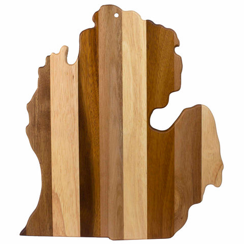 The Totally Bamboo Rock & Branch® Shiplap Series Michigan Mitten Cutting Board is a wooden cutting board designed in the shape of Michigan with alternating light and dark wood stripes. It includes a small hole near the top for easy hanging, making it an ideal piece of functional wall art.