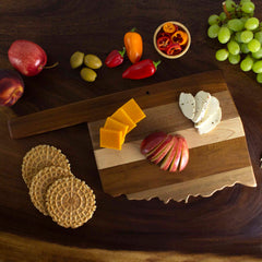 From the Rock & Branch® Shiplap Series by Totally Bamboo, the Oklahoma Cutting Board beautifully presents cheddar and herb-crusted cheese alongside red apple slices. It's artistically surrounded by round crackers, red and yellow peppers, cherry tomatoes, and a cluster of green grapes, making it ideal for a rustic yet sophisticated display.