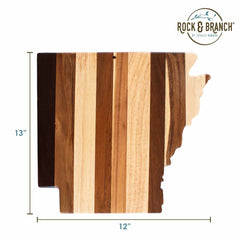 The Rock & Branch® Shiplap Series Arkansas Cutting Board by Totally Bamboo beautifully showcases an artistic design with stunning wood plank colors. Measuring 13 inches tall and 12 inches wide, it features the Rock & Branch logo in the upper right corner, adding a touch of sophistication to your culinary wall art.