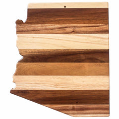 Introducing the Rock & Branch® Shiplap Series Arizona Cutting Board by Totally Bamboo: a wooden cutting board shaped like the outline of Arizona, featuring stunning alternating light and dark wood stripes. A true masterpiece that blends style and functionality seamlessly.