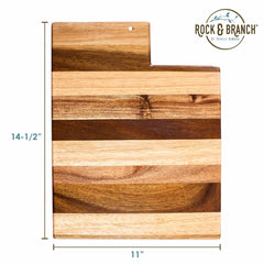 Introducing the Totally Bamboo Rock & Branch® Shiplap Series Utah Cutting Board, featuring alternating light and dark stripes. Measuring 14-1/2 by 11 inches, it boasts a slightly offset top right corner elegantly imprinted with the "Rock & Branch" logo. A perfect blend of rustic charm and modern elegance for your kitchen.