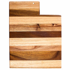 Introducing the Rock & Branch® Shiplap Series Utah Cutting Board by Totally Bamboo: a wooden cutting board crafted in the shape of Utah, featuring stylish alternating light and dark wood stripes. It includes a handy small hole at the top for effortless hanging and display.