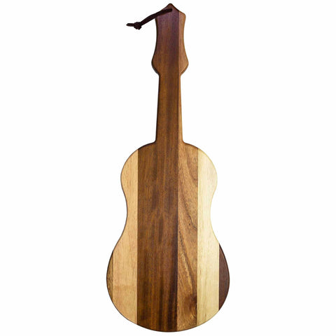 Introducing the Rock & Branch® Shiplap Series Ukulele Cutting Board from Totally Bamboo, a wooden masterpiece that showcases alternating light and dark wood plank colors. This guitar-shaped board features a handle topped with a leather cord, perfectly fusing functionality with musical flair.