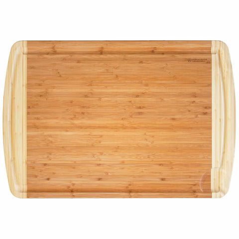 The 600SI Large Cutting Board & Noodle Board, measuring 30" x 20", by Totally Bamboo showcases a smooth surface with rounded edges and two grooves along the shorter sides for easy handling. Its natural bamboo grain provides a warm, earthy appearance, making it an ideal addition to any kitchen.