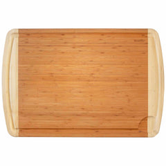 This 36" x 24" 800SI XL Cutting Board & Noodle Board by Totally Bamboo highlights light wood accents on the edges. It includes a small groove in one corner and built-in side handles for easy transport, making it ideal for use as a charcuterie board.