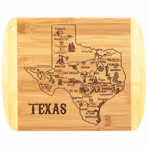 The "A Slice of Life Texas Cutting Board" by Totally Bamboo is an 11" x 8-3/4" bamboo charcuterie board elegantly engraved with a detailed map of Texas. It showcases city names and landmarks such as Dallas, Austin, San Antonio, and Houston, with icons representing regional attractions and the word "TEXAS" prominently featured in this laser-engraved artwork.