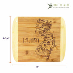 A bamboo cutting board titled "A Slice of Life New Jersey" by Totally Bamboo, featuring an intricately engraved map of New Jersey with its cities and landmarks. It measures 11" x 8-3/4" and includes the brand's logo in the top right corner, beautifully highlighting the state's outline.