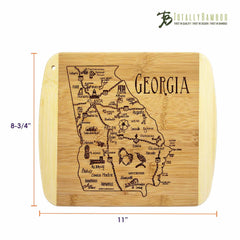 The "A Slice of Life Georgia Cutting Board" by Totally Bamboo features an engraved map of Georgia with prominent cities and landmarks. This elegant board measures 11 inches by 8-3/4 inches, showcasing the state's outline beautifully and enhancing any kitchen decor.