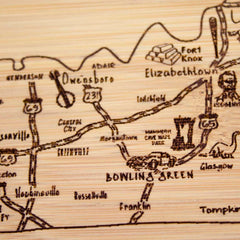 Part of the Totally Bamboo Slice of Life Collection, this intricately designed A Slice of Life Kentucky Cutting Board beautifully captures the essence of Kentucky, featuring cities like Bowling Green and landmarks such as Fort Knox. Roads like I-65 complement the state's charming outline, evoking a sense of adventure.