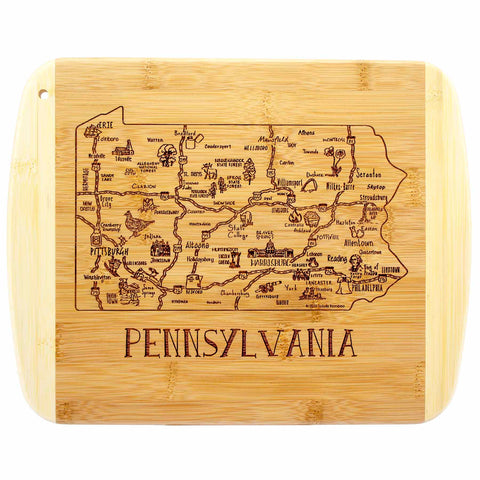 The Totally Bamboo "A Slice of Life Pennsylvania Cutting Board" is a beautifully crafted bamboo piece, laser-engraved with a detailed map of Pennsylvania. It highlights cities and landmarks such as Pittsburgh, Harrisburg, and Philadelphia, and proudly displays "PENNSYLVANIA" at the bottom. This 11" x 8-3/4" cutting board serves as an ideal choice for charcuterie presentation or as eye-catching kitchen décor.