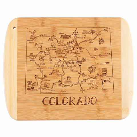 Introducing the A Slice of Life Colorado Cutting Board by Totally Bamboo, measuring 11" x 8-3/4". This delightful bamboo cutting board features a playful map of Colorado, complete with landmarks, wildlife, and activities. The state outline is intricately designed with "Colorado" gracefully engraved beneath it.