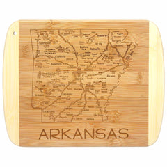 As part of the Slice of Life Collection by Totally Bamboo, the A Slice of Life Arkansas Cutting Board measures 11" x 8-3/4" and showcases a detailed map of Arkansas with cities and notable landmarks. The bottom features an elegantly carved "Arkansas," making it a unique piece of state artwork for your kitchen.