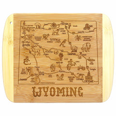 Introducing the A Slice of Life Wyoming Cutting Board by Totally Bamboo. This 11" x 8-3/4" bamboo board is part of the Slice of Life Collection and features intricate laser-engraved artwork depicting a detailed map of Wyoming. Explore illustrations of landmarks, animals, and cities such as Cheyenne and Casper, with "Wyoming" elegantly carved at the bottom.