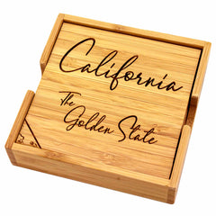 The 4-Piece California Puzzle Coaster Set with Case by Totally Bamboo showcases "California The Golden State" beautifully laser-engraved on the top coaster. This distinctive set includes a matching wooden holder, combining style and functionality for your home.