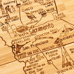 The 4-Piece California Puzzle Coaster Set with Case by Totally Bamboo features a wooden engraved map of Northern California, highlighting cities such as San Francisco, Sacramento, and San Jose. These unique coasters are laser-engraved with detailed depictions of natural landmarks like Lake Tahoe and Yosemite, beautifully illustrating the region's geography and attractions.