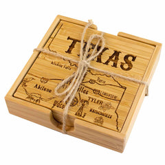 A 4-Piece Texas Puzzle Coaster Set with Case from Totally Bamboo showcases laser-engraved artwork of Texas maps on wooden coasters. Tied with twine, the top coaster prominently features "Texas" and city names such as Waco, Dallas, and Tyler. These coasters are perfect gifts for anyone who appreciates the charm of a State Puzzle Coaster Set.