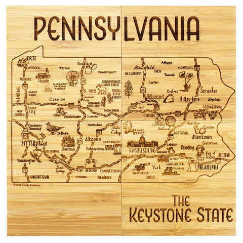 The 4-Piece Pennsylvania Puzzle Coaster Set with Case by Totally Bamboo showcases detailed engravings of cities and roads, prominently featuring major urban centers like Pittsburgh and Philadelphia. The set is elegantly titled "PENNSYLVANIA" at the top and includes the phrase "The Keystone State" at the bottom, making it a perfect choice for geography enthusiasts.