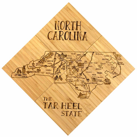 Introducing the 4-Piece North Carolina Puzzle Coaster Set with Case by Totally Bamboo – a perfect gift that beautifully encapsulates the essence of North Carolina. This laser-engraved wooden coaster set highlights major cities and landmarks, featuring "The Tar Heel State" in a unique design with each piece forming a square turned into a diamond orientation when assembled together.