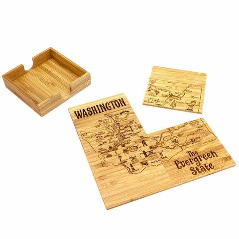 A 4-Piece Washington Puzzle Coaster Set with Case by Totally Bamboo features a wooden puzzle of Washington, labeled "The Evergreen State." With pieces loosely arranged and an empty wooden box nearby, this laser-engraved artwork includes icons of landmarks and nature features, providing a unique set of coasters for any table.