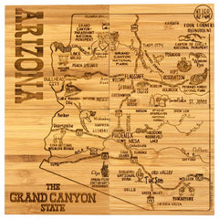 Introducing the 4-Piece Arizona Puzzle Coaster Set with Case by Totally Bamboo: a laser-engraved wooden map of Arizona titled "The Grand Canyon State." It highlights major cities, landmarks, and attractions such as Grand Canyon National Park, Flagstaff, Phoenix, and Tucson. This unique piece functions both as a delightful coaster set and an engaging state puzzle for enthusiasts.