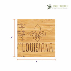 This distinctive coaster from the "Totally Bamboo" 4-Piece Louisiana Puzzle Coaster Set with Case is a square bamboo piece featuring a laser-engraved fleur-de-lis design along with place names like Tallulah and Lake Providence, as well as the word "Louisiana." It measures 4 inches by 4 inches and displays the brand logo in the top right corner.