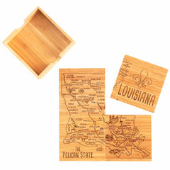 The 4-Piece Louisiana Puzzle Coaster Set with Case by Totally Bamboo features laser-engraved artwork with city names and a fleur-de-lis on its wooden pieces, which double as unique coasters. Arranged beneath the lid adorned with "Louisiana" and "The Pelican State," the puzzle sits partially assembled next to an open box from Totally Bamboo.