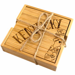 A distinctive set of Totally Bamboo's 4-Piece Kentucky Puzzle Coaster Set with Case. The top laser-engraved coaster showcases the word "Kentucky" and a map outline highlighting cities such as Louisville and Lexington, beautifully tied together with twine.