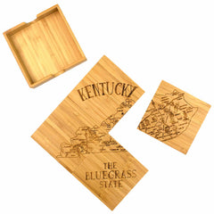 Kentucky map and attractions artwork engraved across 4 square bamboo coasters with one coaster  and bamboo storage case to the side