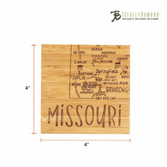 Introducing the 4-Piece Missouri Puzzle Coaster Set with Case by Totally Bamboo, featuring a distinctive bamboo coaster laser-engraved with a map of Missouri. Prominent city names such as Springfield, Joplin, Branson, and Lamar are detailed on this exclusive piece. The word "MISSOURI" is elegantly inscribed at the bottom of the 4x4 inch coaster, which is part of a unique State Puzzle Coaster Set.