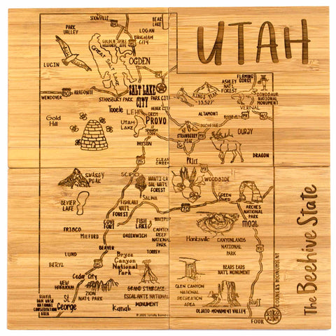 Four square bamboo coasters pushed together to show entire Utah map and attractions artwork engraved across all coasters