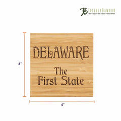 This distinctive coaster, part of the 4-Piece Delaware Puzzle Coaster Set with Case by Totally Bamboo, measures 4 inches by 4 inches and is crafted from square bamboo wood. It features the inscription "DELAWARE The First State" along with the "Totally Bamboo" logo in the top right corner, making it an exceptional addition to any collection.