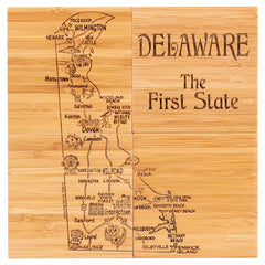 The "4-Piece Delaware Puzzle Coaster Set with Case" from Totally Bamboo features a unique laser-engraved map showcasing towns, landmarks, and beaches of Delaware like Wilmington and Dover. The phrase "Delaware: The First State" is prominently displayed, making it an ideal addition to any unique coaster collection or paired with a wooden cutting board.