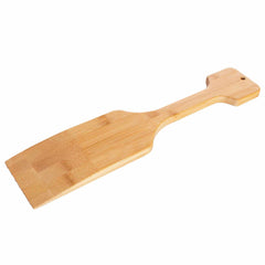 The Totally Bamboo BBQ Grill Scraper with Bottle Opener features a gracefully light-colored design and a rectangular flat end ideal for scraping grills. Its handle is equipped with a handy hole for hanging, showcased beautifully against a simple white backdrop.