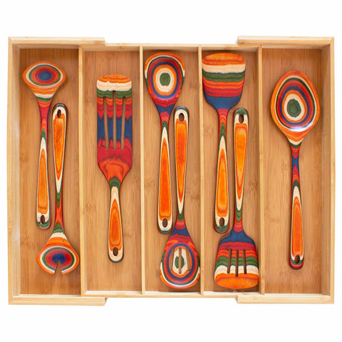 An Expandable Drawer Organizer by Totally Bamboo includes five vividly designed painted kitchen utensils, featuring intricate multicolored patterns. The set comprises spoons and spatulas adorned with vibrant red, orange, green, and blue hues, ideal for enhancing your kitchen organization.