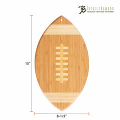 The Football Shaped Cutting Board by Totally Bamboo is an elegant bamboo creation, intricately designed to resemble a football complete with laces. It measures 15 inches by 8.5 inches, making it ideal for your tailgate spread. The brand's logo, "Totally Bamboo," adorns the top-right corner for a touch of style and practicality.