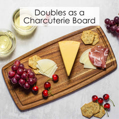 16 inch Acacia Wood cutting board with juice groove serving charcuterie food with glasses of wine, text reads doubles as charcuterie board