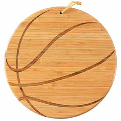 The Basketball Shaped Cutting Board by Totally Bamboo, measuring 12" x 12", is perfect for game day entertaining with its unique basketball design etched into the surface. Its light brown color features darker lines to mimic a basketball pattern, and it includes a convenient loop at the top for hanging.