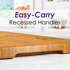 An Alabama Engraved XL Charcuterie Board from Totally Bamboo, measuring 30" x 8-1/2" and featuring recessed handles for easy carrying, rests on a kitchen counter. The image text "Easy-Carry Recessed Handles" emphasizes the board's practical design, making it ideal for any occasion as an extra-large charcuterie board.