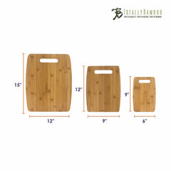 A set of three bamboo cutting boards from the Totally Bamboo brand is shown against a white background. The 3-Piece Cutting Board Set includes handle cutouts with sizes measuring 15"x12", 12"x9", and 9"x6". The brand name "Totally Bamboo" is elegantly inscribed at the top right corner, making it an ideal addition to any kitchen cutting board collection.