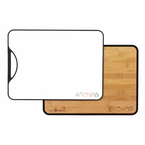 Displayed are two cutting boards from the "Poly-Boo" Reversible Bamboo/Plastic Cutting Board collection by Totally Bamboo. The top board is a reversible plastic piece in white, adorned with small colorful vegetable icons at the bottom. The bottom board is crafted from bamboo with black edges and features similar vegetable icons in the corner. Each board includes a convenient handle on one side.