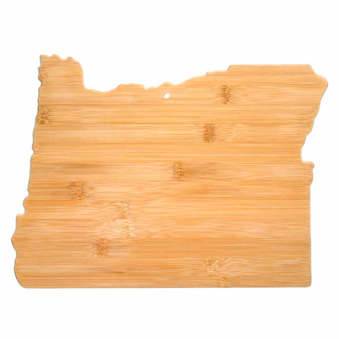 The Oregon Cutting Board by Totally Bamboo, measuring 14-1/2" x 10-3/4", is expertly crafted from light bamboo, highlighting its exquisite natural grain pattern. It features a small hole near the top center, enabling it to also serve as delightful wall decor when not in use.