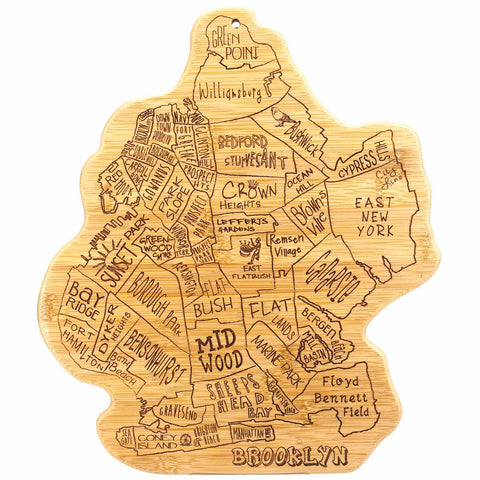 Introducing the Totally Bamboo City Life Brooklyn Cutting Board, measuring 13-1/2" x 11-3/4". This bamboo cutting board, shaped like the borough of Brooklyn, showcases laser-engraved artwork featuring neighborhood names such as Greenpoint, Williamsburg, Bedford Stuyvesant, Crown Heights, and Midwood. Its detailed map-like design makes it both a practical kitchen tool and a decorative piece for your home.