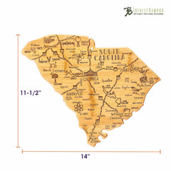 The "Destination South Carolina Cutting Board" by Totally Bamboo is made from bamboo and shaped like the state of South Carolina. It showcases laser-engraved artwork with city names and geographic details, measuring 14 inches by 11.5 inches, and proudly displays the brand's logo in the top right corner.