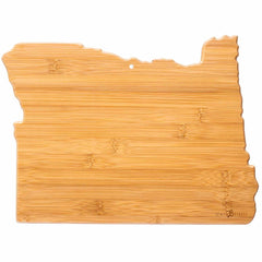 The Totally Bamboo Destination Oregon Cutting Board, measuring 14-1/2" x 10-3/4", is crafted from stunning natural wood grain and reflects the geography of Oregon. Its surface boasts intricate laser-engraved artwork, adding to its rustic charm and making it both a practical and delightful focal point in any kitchen.