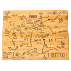 The "Destination Colorado Cutting Board" by Totally Bamboo, measuring 14-1/2" x 10-3/4", is a state-themed board that displays an illustrated map of Colorado on bamboo. It features cities such as Denver, Colorado Springs, and Aspen. The laser-engraved artwork includes landmarks, animals, and geographic features with playful drawings and intricate details.